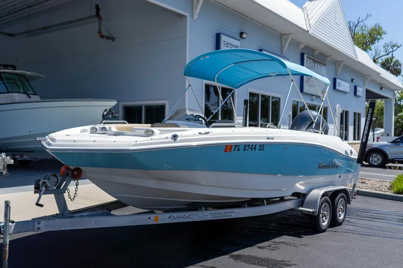 Slide: The Image of 2020 NauticStar 203 SC boat on trailer outside dealership. - 9