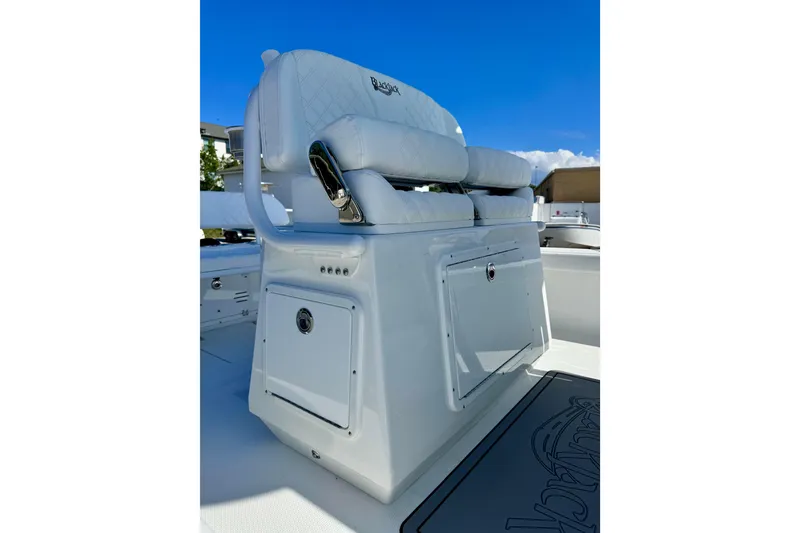 Slide: The Image of 2026 BlackJack 256 Coastal boat seat with storage, featuring white upholstery and sleek design. - 12