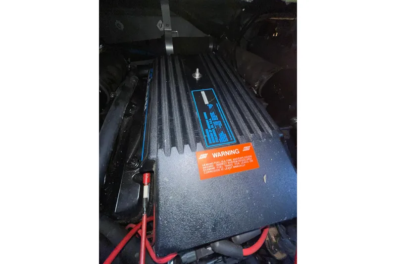 Slide: The Image of Engine compartment of a 1992 Sea Ray 370 Express Cruiser with warning label. - 20