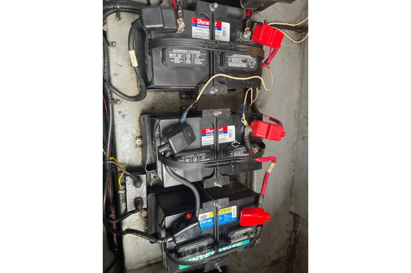Slide: The Image of Battery compartment of a 1992 Sea Ray 370 Express Cruiser with multiple marine batteries. - 23