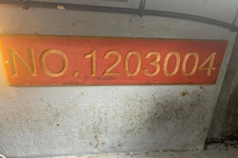 Slide: The Image of Wooden plaque with number 1203004 on a 1992 Sea Ray 370 Express Cruiser. - 24
