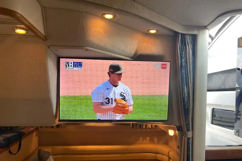 Slide: The Image of Television showing baseball game inside 1992 Sea Ray 370 Express Cruiser cabin. - 8