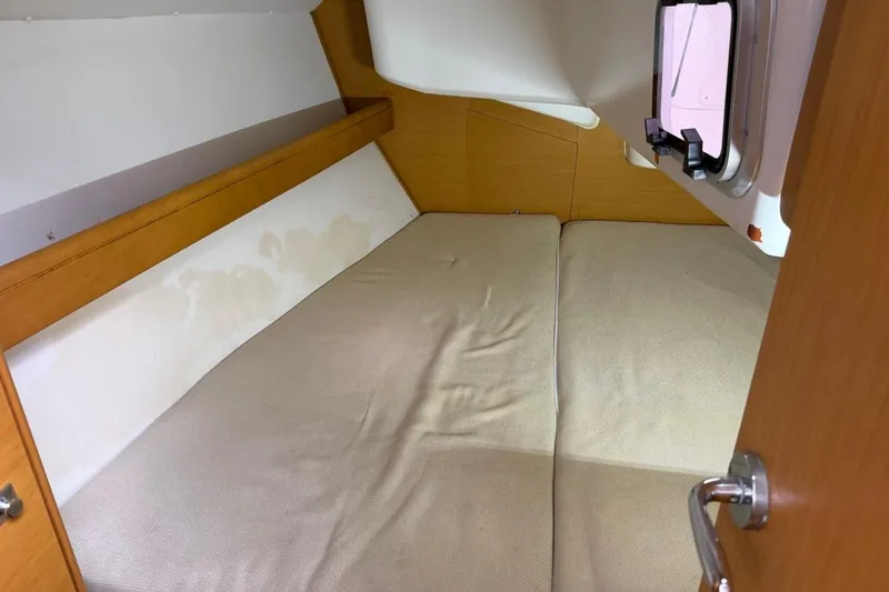 Slide: The Image of Cozy cabin interior of 2011 Jeanneau Sun Odyssey 36i sailboat with comfortable bedding. - 11