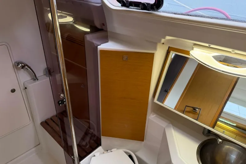 Slide: The Image of Interior of 2011 Jeanneau Sun Odyssey 36i yacht bathroom with mirror and sink. - 12