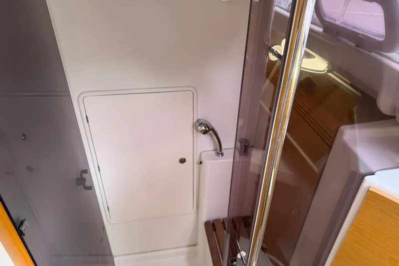 Slide: The Image of Interior of 2011 Jeanneau Sun Odyssey 36i yacht, featuring a compact shower area. - 13