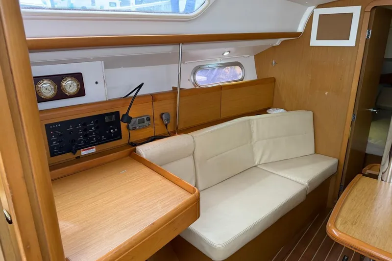 Slide: The Image of Interior of 2011 Jeanneau Sun Odyssey 36i yacht with beige seating and wooden accents. - 15