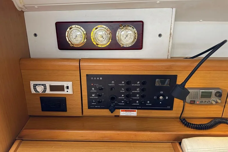Slide: The Image of Control panel of a 2011 Jeanneau Sun Odyssey 36i sailboat with navigation instruments. - 16