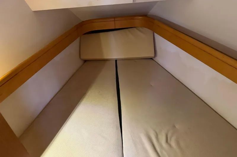 Slide: The Image of Interior cabin of 2011 Jeanneau Sun Odyssey 36i sailboat, featuring cozy sleeping quarters. - 20