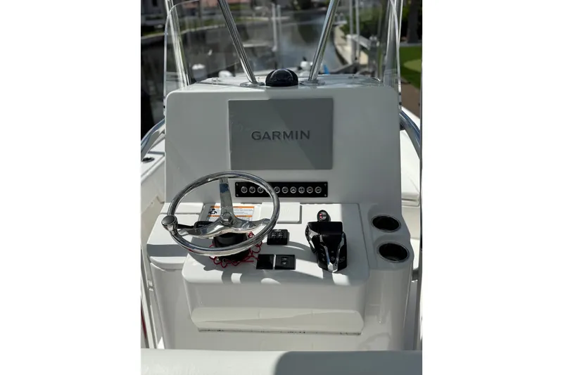 Slide: The Image of 2024 Contender 26 Bay boat console with Garmin navigation system and steering wheel. - 6