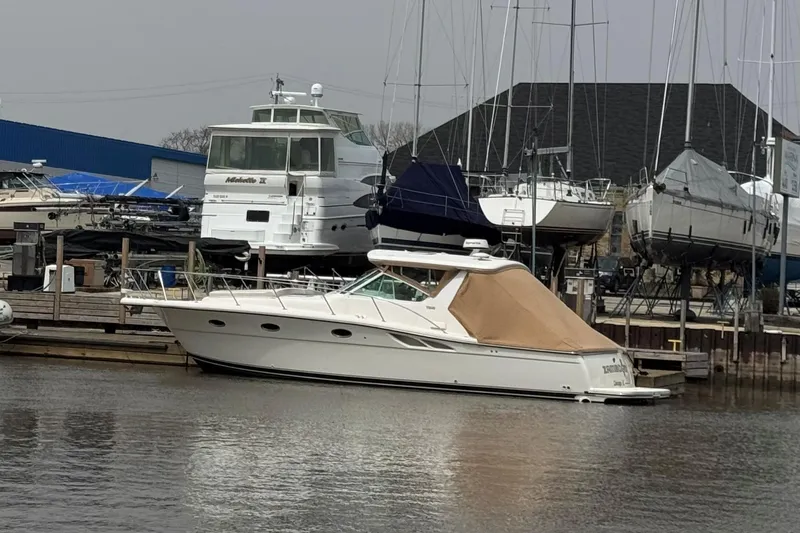 The Image of 2003 Tiara Yachts 3500 Open docked at a marina with other boats. - 0