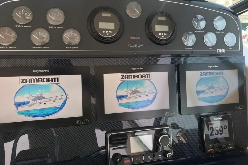 Slide: The Image of Dashboard of a 2003 Tiara Yachts 3500 Open with Raymarine displays. - 8