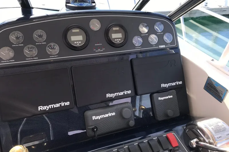 Slide: The Image of Dashboard of a 2003 Tiara Yachts 3500 Open with Raymarine navigation equipment. - 9
