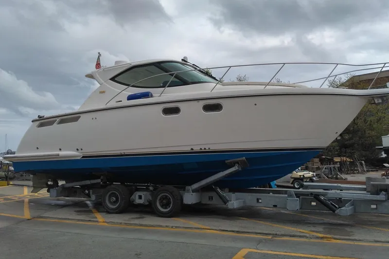 The Image of 2009 Tiara Yachts 3500 Sovran on trailer, cloudy sky background. - 0