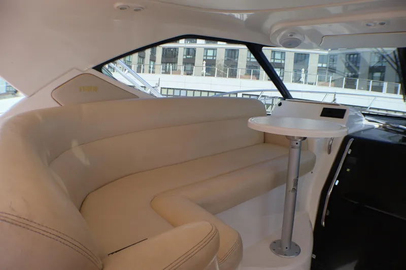 Slide: The Image of Luxurious interior of 2009 Tiara Yachts 3500 Sovran with plush seating and table. - 10