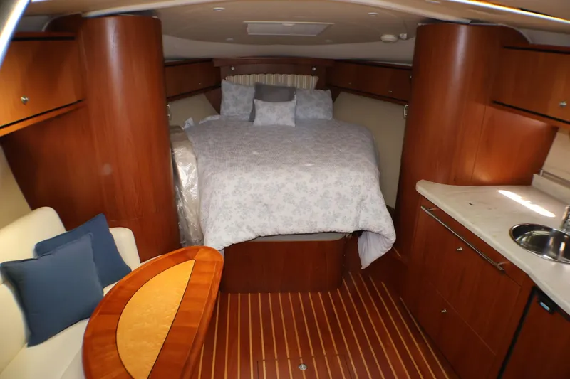 Slide: The Image of Luxurious 2009 Tiara Yachts 3500 Sovran cabin interior with bed and seating area. - 13