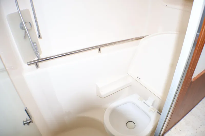 Slide: The Image of Bathroom interior of 2009 Tiara Yachts 3500 Sovran, featuring shower and toilet. - 20