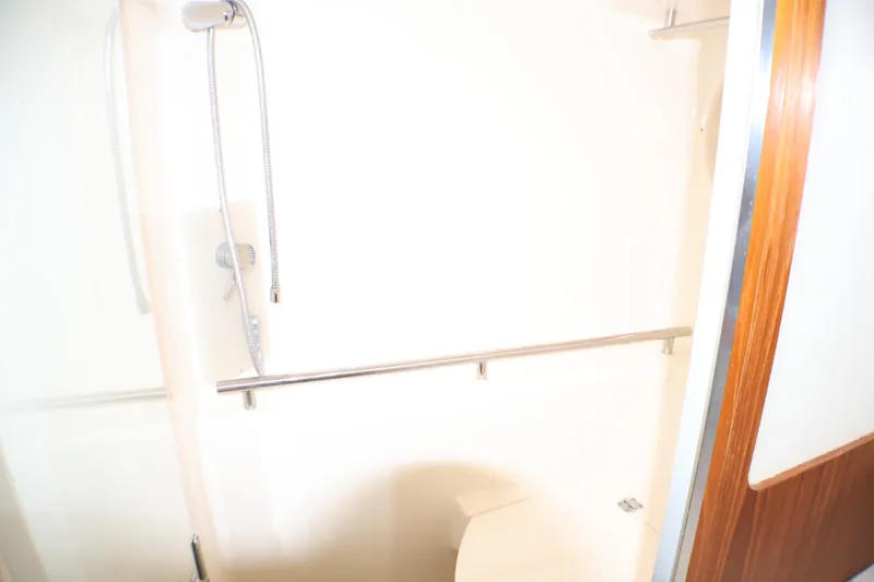 Slide: The Image of Shower area in 2009 Tiara Yachts 3500 Sovran, featuring sleek fixtures and wooden accents. - 21