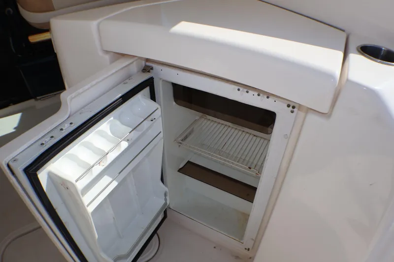 Slide: The Image of Open refrigerator on 2009 Tiara Yachts 3500 Sovran, showcasing interior storage space. - 25