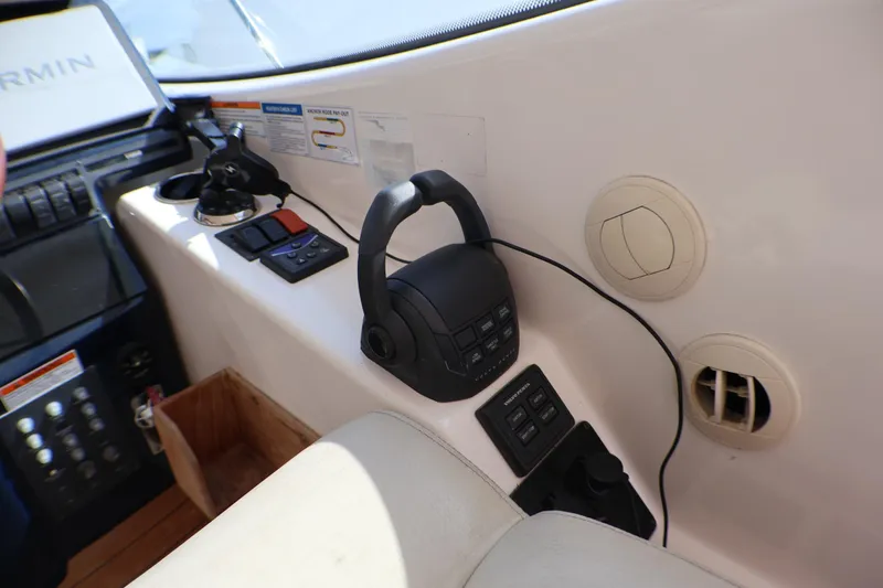Slide: The Image of Control panel of a 2009 Tiara Yachts 3500 Sovran with navigation equipment and switches. - 7