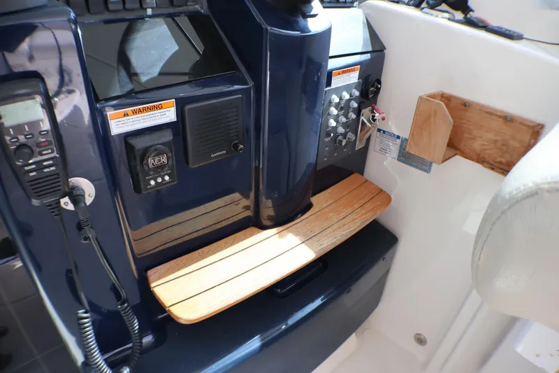 Slide: The Image of Control panel of a 2009 Tiara Yachts 3500 Sovran with navigation and communication equipment. - 8