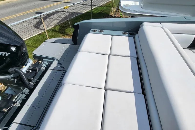Slide: The Image of 2023 Aviara AV32 OB boat with sleek seating and powerful outboard motor. - 13