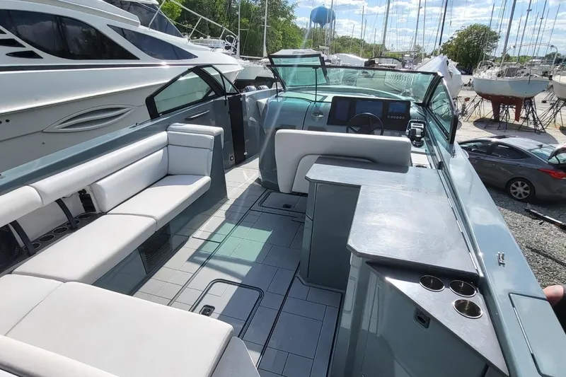 Slide: The Image of 2023 Aviara AV32 OB boat interior with sleek seating and modern dashboard. - 14