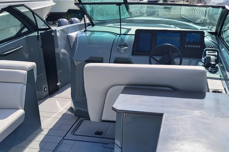 Slide: The Image of 2023 Aviara AV32 OB boat interior with modern dashboard and seating. - 15