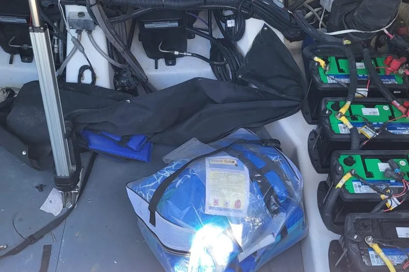 Slide: The Image of Interior view of 2023 Aviara AV32 OB boat showing batteries and equipment storage. - 6