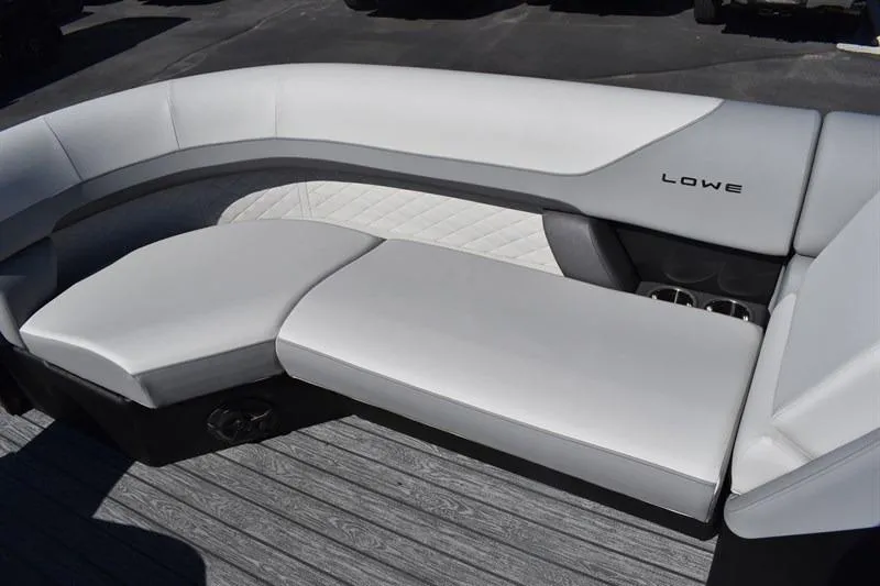 Slide: The Image of Luxurious seating on 2026 Lowe SF 232 WT Sport Fish boat, featuring sleek white upholstery. - 14