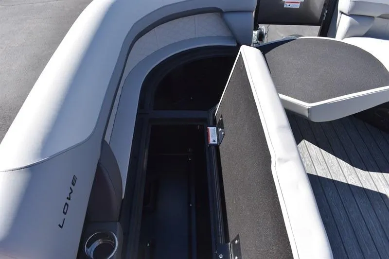 Slide: The Image of 2026 Lowe SF 232 WT Sport Fish boat interior with open storage compartment. - 18
