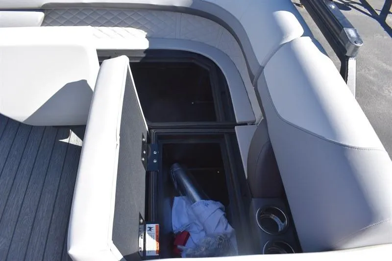 Slide: The Image of Storage compartment in 2026 Lowe SF 232 WT Sport Fish boat with cushioned seating. - 20