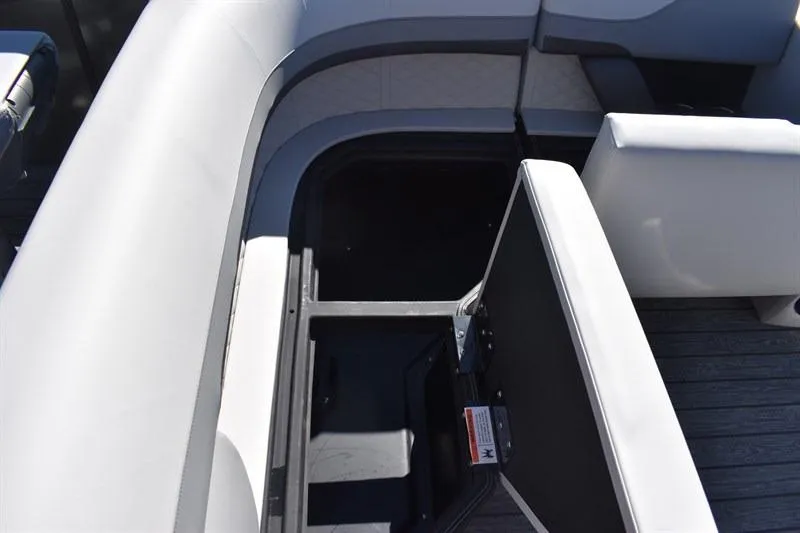 Slide: The Image of 2026 Lowe SF 232 WT Sport Fish boat interior with open storage compartment. - 21