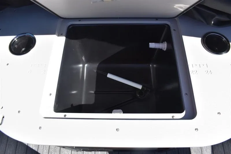Slide: The Image of Open storage compartment on 2026 Lowe SF 232 WT Sport Fish boat. - 26