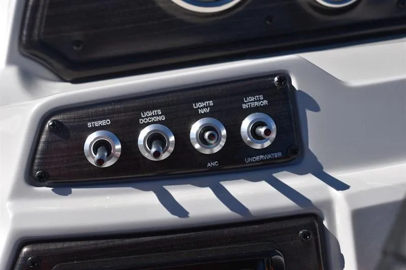 Slide: The Image of Control panel of 2026 Lowe SF 232 WT Sport Fish boat with various switches. - 29