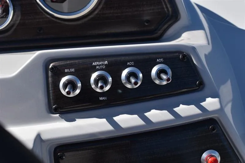 Slide: The Image of Control panel of 2026 Lowe SF 232 WT Sport Fish boat with switches for bilge and accessories. - 31