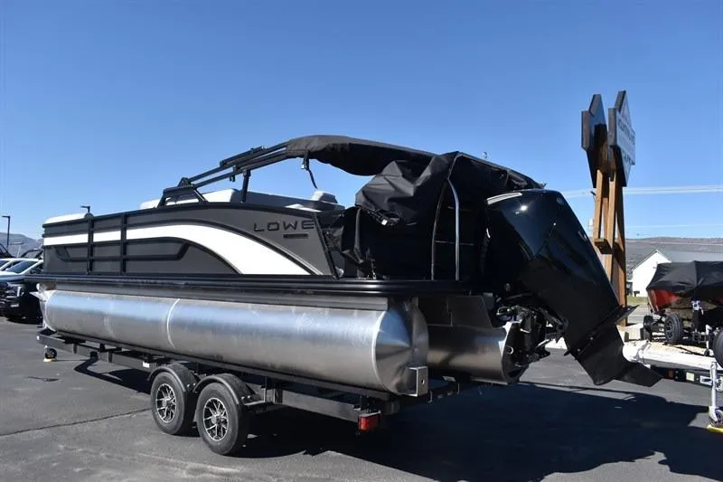 Slide: The Image of 2026 Lowe SF 232 WT Sport Fish pontoon boat on trailer, outdoor display. - 8