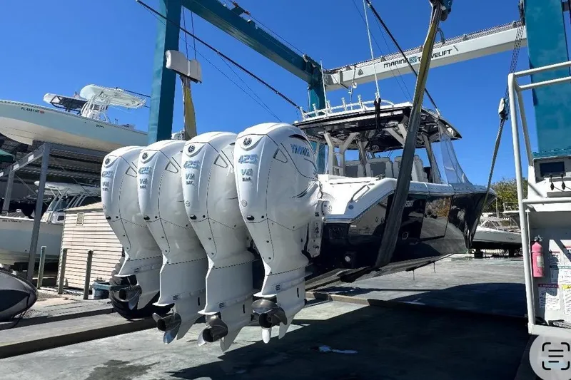 Slide: The Image of 2023 Pursuit S 428 Sport boat with four outboard engines. - 3