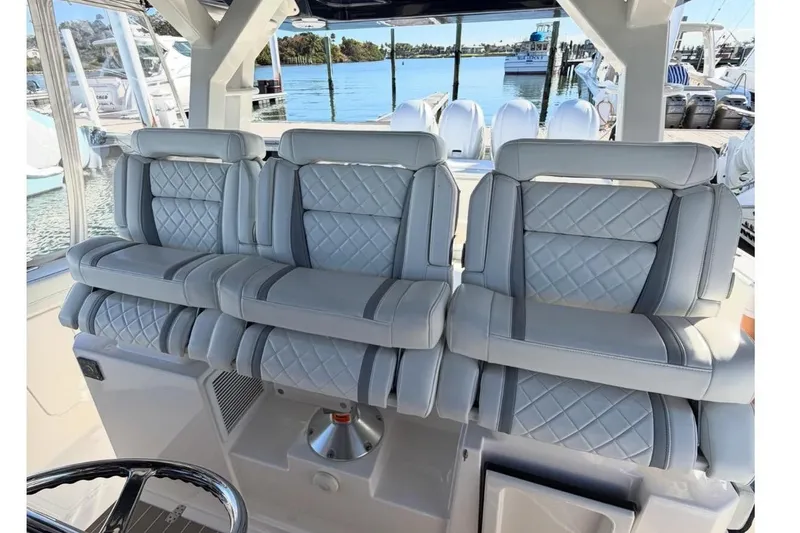 Slide: The Image of Luxurious seating on a 2023 Pursuit S 428 Sport boat. - 4