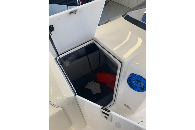 Slide: The Image of Open storage compartment on 2006 Conquest 28 Top Cat II boat. - 13