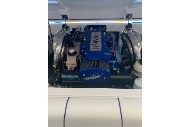 Slide: The Image of 2006 Conquest 28 Top Cat II engine with blue 525 EFI Mercury motor. - 14