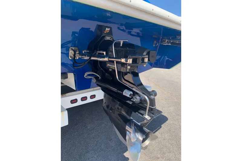 Slide: The Image of Rear view of a 2006 Conquest 28 Top Cat II boat's outboard motor and propeller. - 16