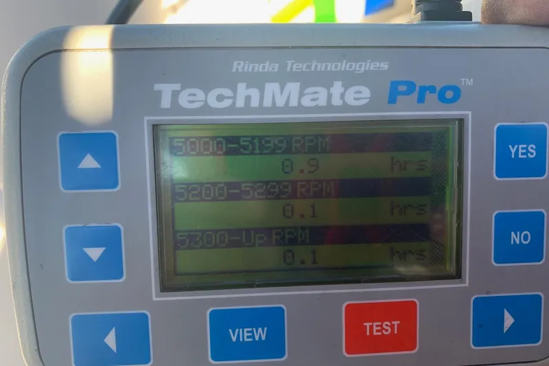 Slide: The Image of TechMate Pro diagnostic tool displaying RPM hours for a 2006 Conquest 28 Top Cat II. - 20
