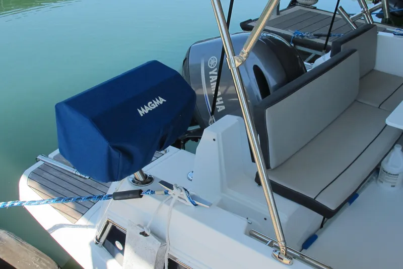 Slide: The Image of 2020 Jeanneau NC 795 boat with Yamaha engine and Magma grill cover. - 10