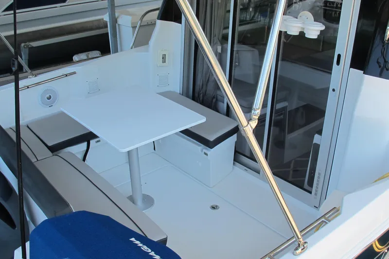 Slide: The Image of 2020 Jeanneau NC 795 boat interior with seating and table, featuring modern design. - 11