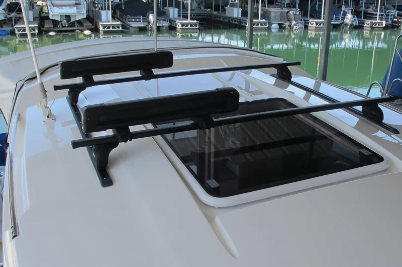 Slide: The Image of 2020 Jeanneau NC 795 boat roof with mounted racks at marina. - 12