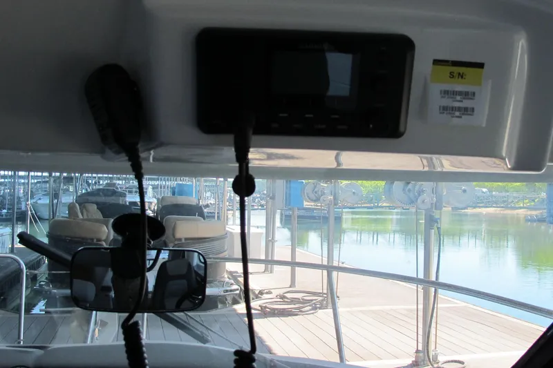 Slide: The Image of Interior view of 2020 Jeanneau NC 795 boat with dock in background. - 17