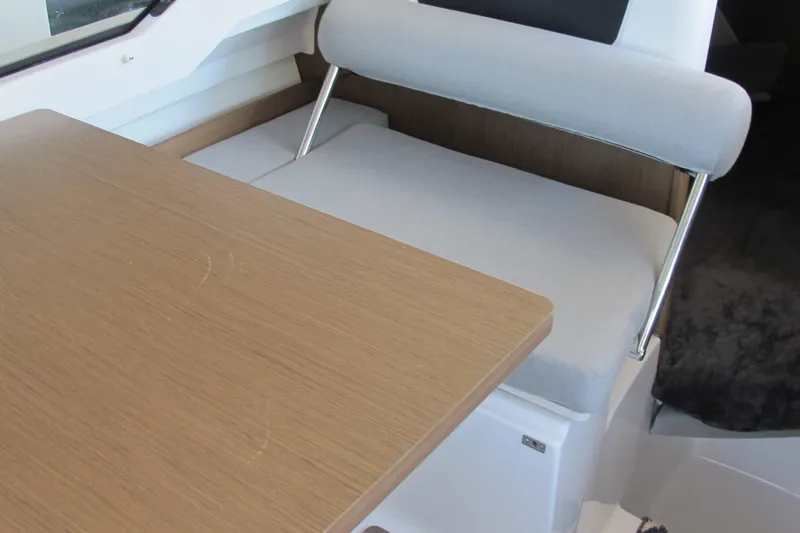 Slide: The Image of Interior seating and table of 2020 Jeanneau NC 795 boat, featuring modern design. - 20