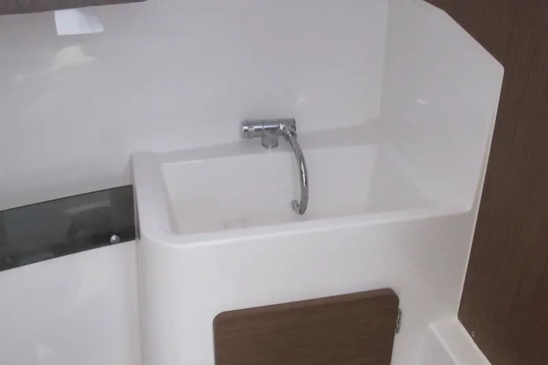 Slide: The Image of Interior sink of 2020 Jeanneau NC 795 boat with modern faucet design. - 26