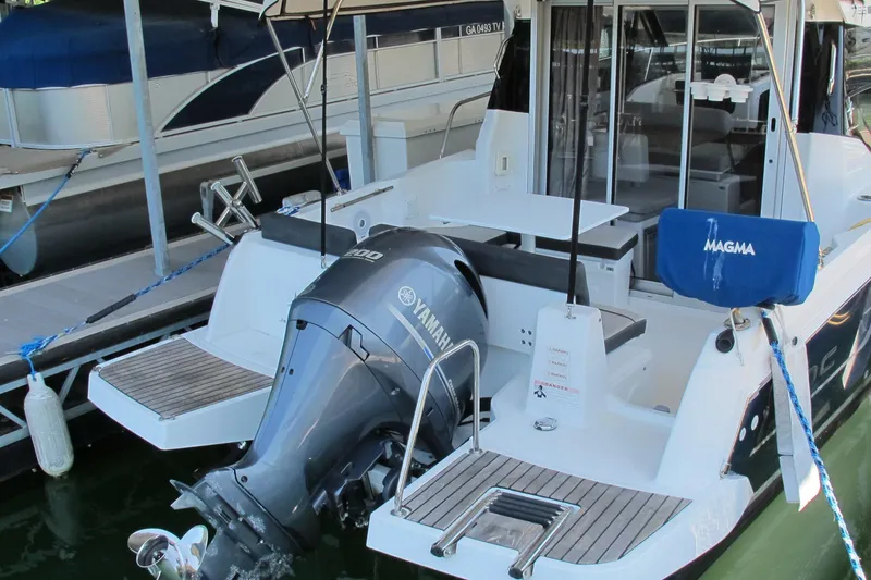 Slide: The Image of 2020 Jeanneau NC 795 boat with Yamaha outboard motor docked at marina. - 7