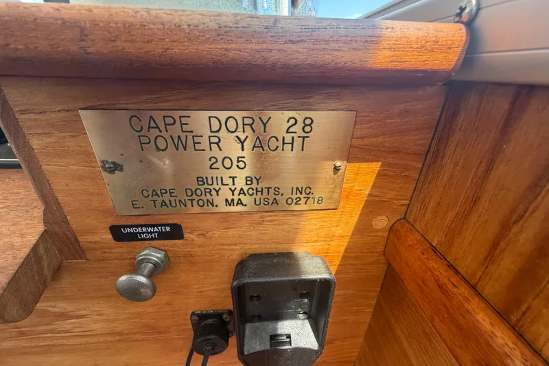 Slide: The Image of Plaque on 1990 Cape Dory 28 Flybridge yacht, featuring model details and builder information. - 10